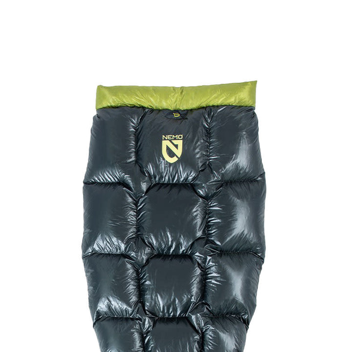 A black and green Pulse™ Endless Promise® Ultralight Backpacking Quilt from NEMO Equipment, featuring the NEMO logo on the front, displayed against a white background.