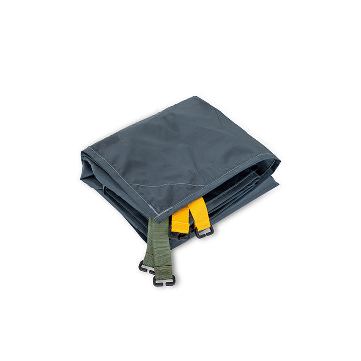 The NEMO Equipment Dragonfly™ Bikepack OSMO™ Footprint is a folded gray polyester tarp with yellow and green straps and black plastic buckles, shown on a white background.