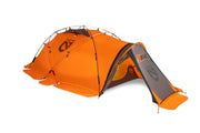 Bright orange Chogori™ Mountaineering Tent by NEMO Equipment—dome-style, four-season tent with a vestibule and multiple support poles. "NEMO" branding appears on the side and vestibule panel, making it ideal for your next adventure.