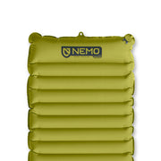The NEMO Equipment Astro™ Insulated Lightweight Sleeping Pad is green, features horizontal air chambers, and has the NEMO logo near the top. It's made from recycled polyester for enhanced durability.
