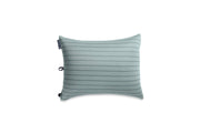 The NEMO Equipment Fillo™ King Luxury Camping Pillow features a light green, subtly striped, machine-washable jersey cover and premium foam fill. Shown against a white background with a visible fabric tag on the side.